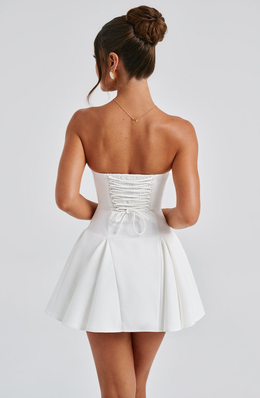 Women's White Mini Playsuit with Strapless Neckline and Bow Detail
